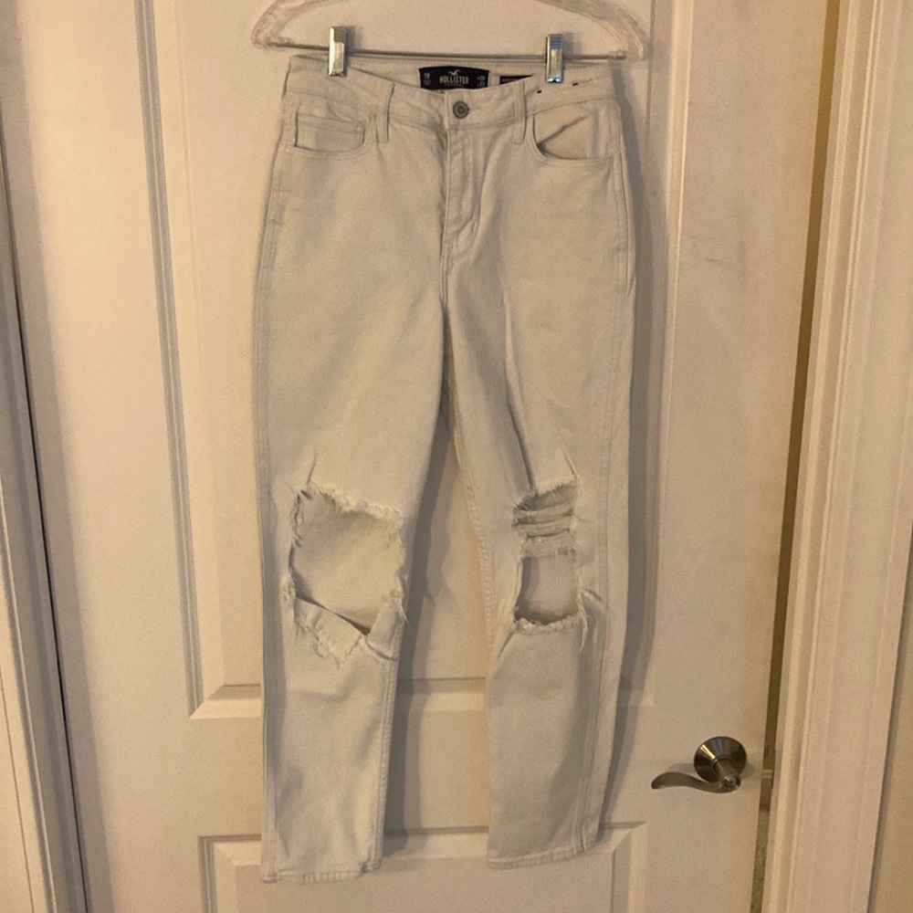 Hollister ultra high rise mom jeans size 7R. White ripped at knees. Cotton blend